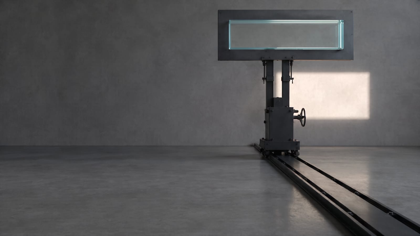 A workshop in shade. A wide slab of thick glass is held high in a steel plate on a carriage that rides a floor rail; a shaft of sun passes through it onto the plaster wall.